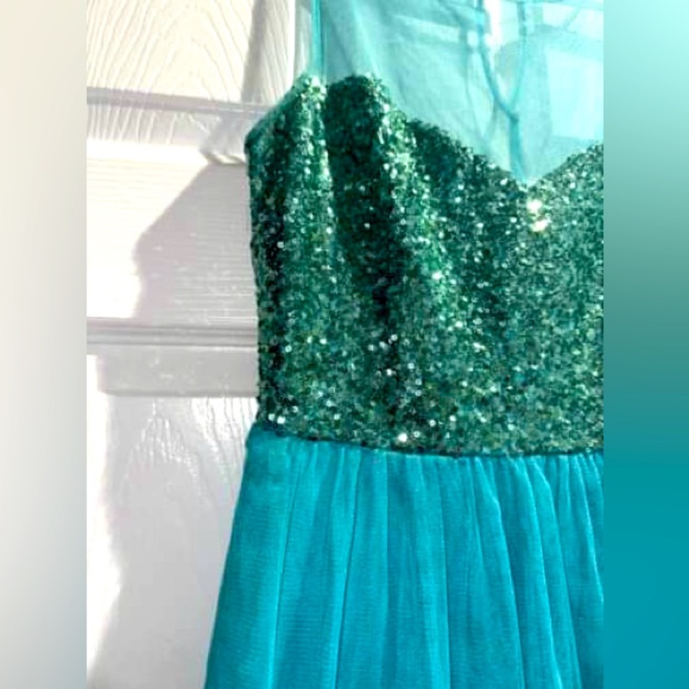 Blue sequinned graduation dress.